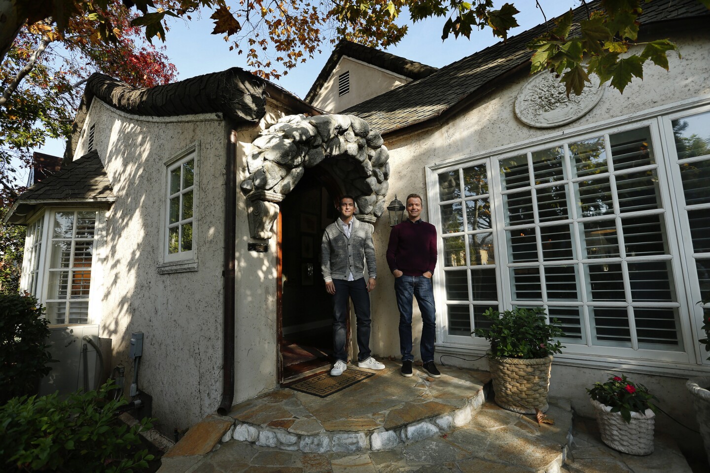 Tom Balamaci, left and Patrick Wildnauer balanced quality with savvy spending as they re-envisioned their 1927 cottage in Wilshire Vista. They worked with interior designer Amalia Gal. The results combine traditional elegance and personal style.