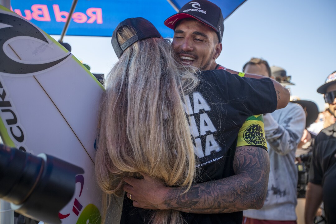 Gabriel Medina tears up as he hugs his wife, Yasmin Brunet, after winning his third World Surf League Championship Title 