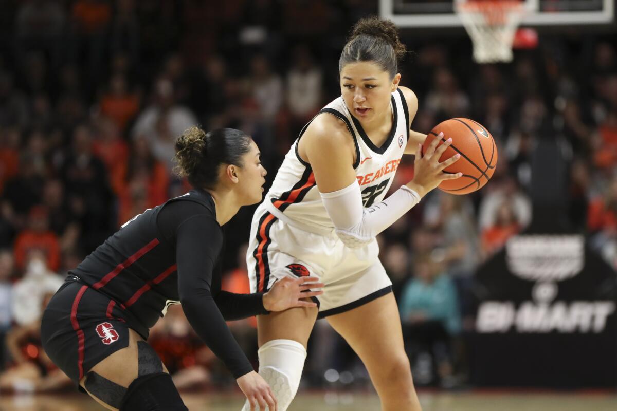 Oregon State guard Talia von Oelhoffen holds the basketball and looks to get past Stanford guard Talana Lepolo