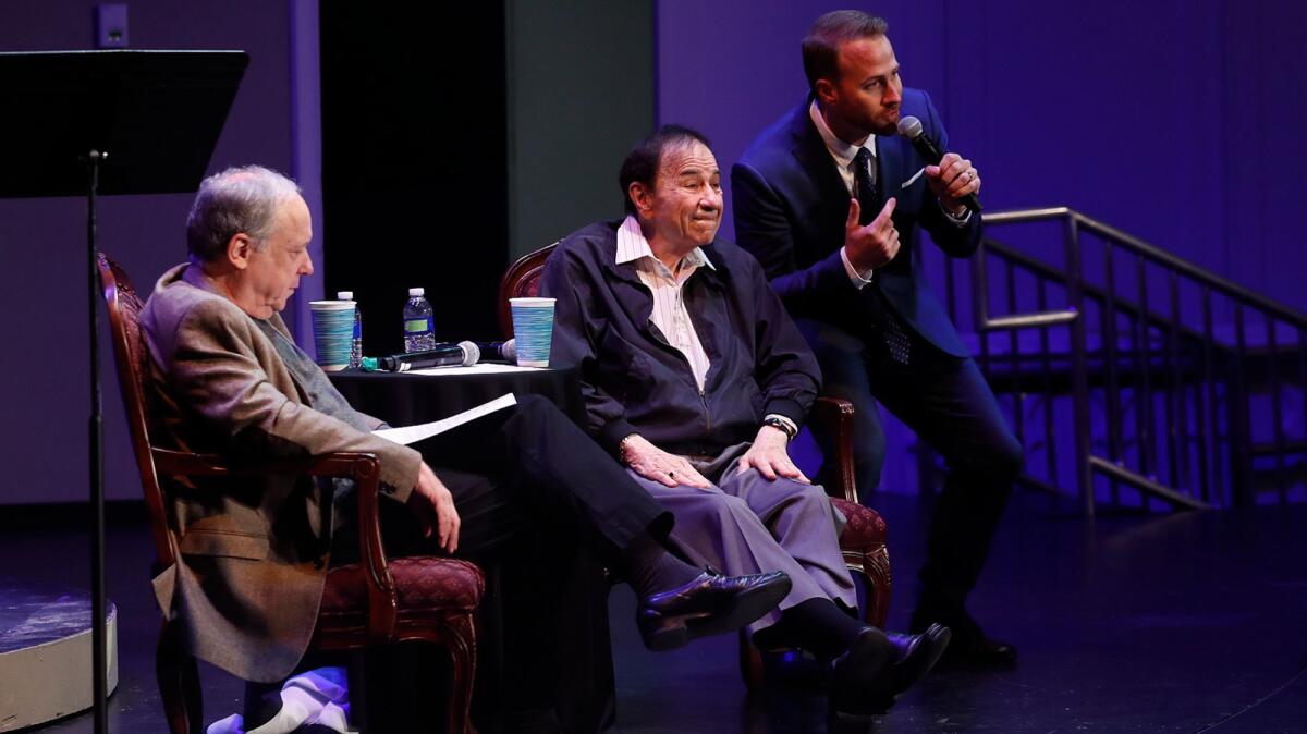 Broadway star Bret Shuford, right, sings a song from "Jungle Book" to Richard Sherman, center, and Bruce Kimmel during the Orange County School of the Arts' Master Artist Series on Oct. 11.