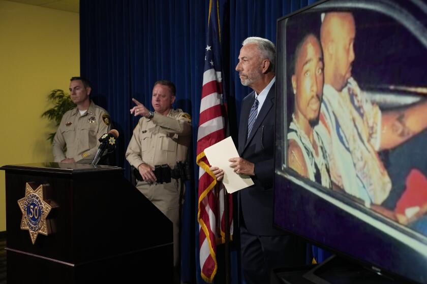 From left, Las Vegas police Lt. Jason Johansson, Sheriff Kevin McMahill and Clark County District Attorney Steve Wolfson attends a news conference on an indictment in the 1996 murder of rapper Tupac Shakur, Friday, Sept. 29, 2023, in Las Vegas. (AP Photo/John Locher)