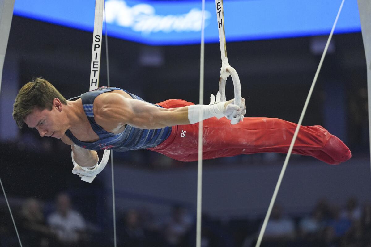Brody Malone competes on the still rings at the U.S. Olympic trials on Thursday.