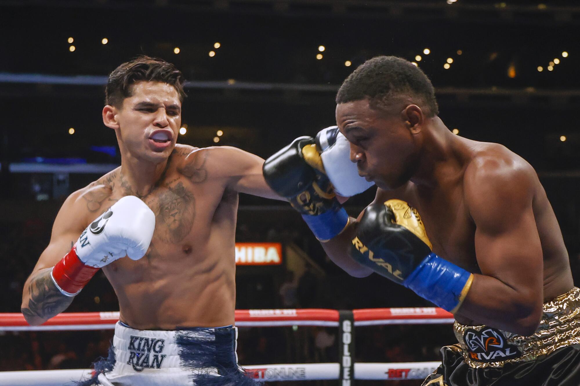 Ryan Garcia, left, punches Javier Fortuna during their lightweight fight at Crypto.com Arena on Saturday night. 
