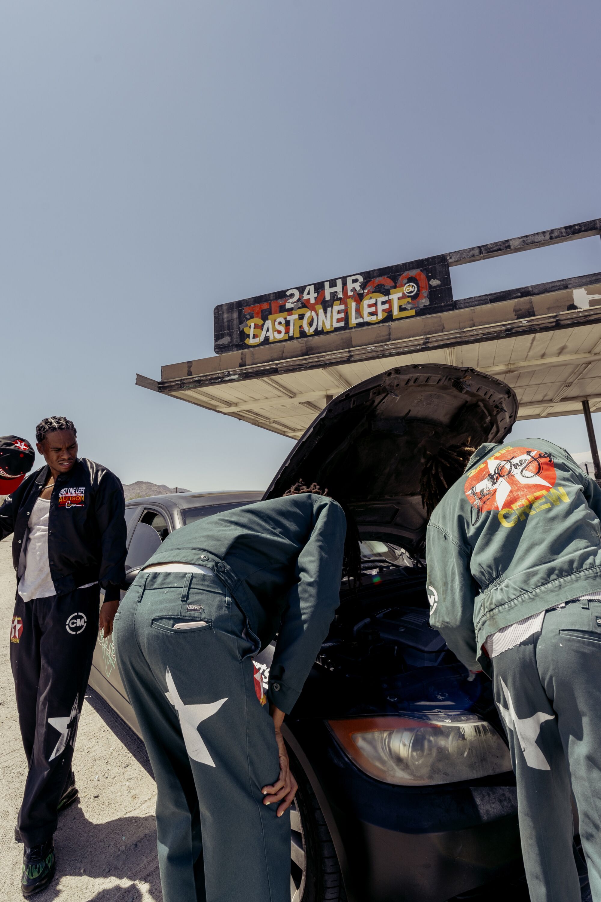 Photo of models posing as mechanics.
