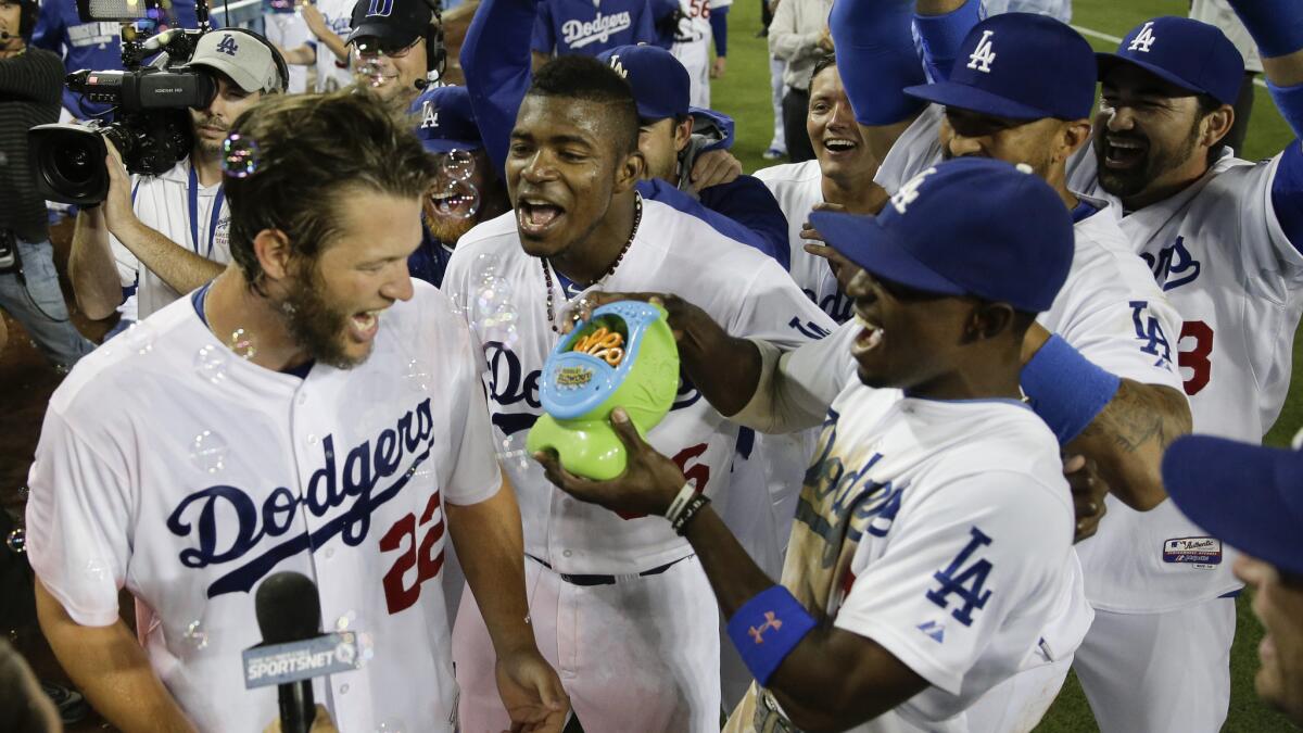 Clayton Kershaw, left, and his teammates celebrate with a bubble machine following his no-hitter against the Colorado Rockies in June. Major League Baseball has advised the Dodgers to stop using the machine during games.