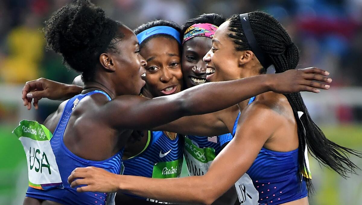 Members of the U.S. women's 400-meter relay team -- from left) Tianna Bartoletta, English Gardner, Tori Bowie and Allyson Felix -- celebrate after winning the gold medal.
