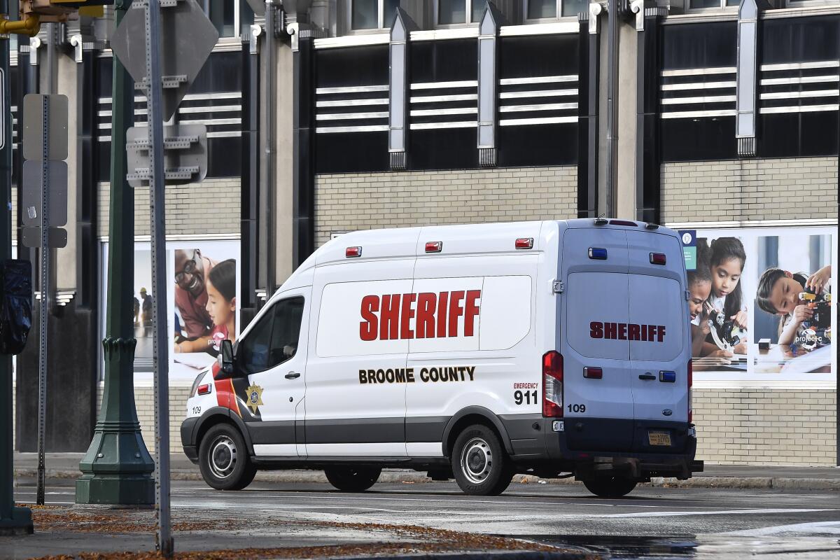 A Broome County Sheriff's van leaves U.S. District Court in Syracuse, N.Y.