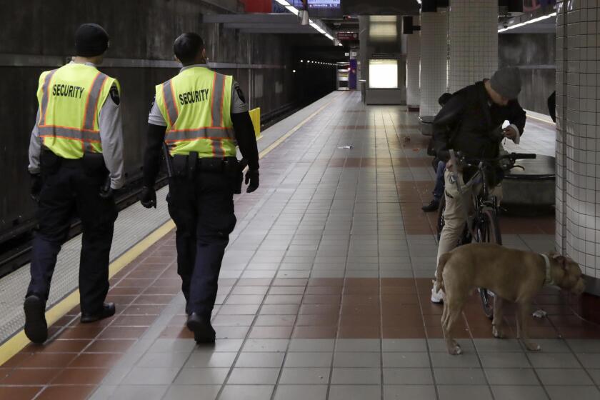 LOS ANGELES, CA - MARCH 29, 2023 - Security officers patrol the MacArthur station in Los Angeles on March 29, 2023. L.A. Metro has been blasting classical music at the MacArthur Park station along the red line as a means to deter crime and prevent unhoused people from taking refuge underground. (Genaro Molina / Los Angeles Times)