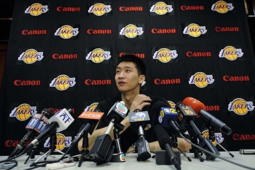 Sun Ye speaks during a press conference Wednesday announcing his signing with the Lakers to a multi-year contract, at the team's training facility in El Segundo.