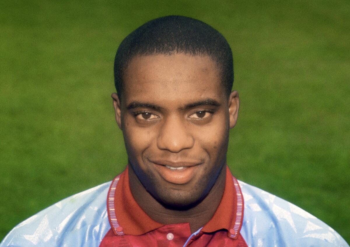 FILE - This July 1, 1991 file photo shows Dalian Atkinson of Aston Villa. British prosecutors accused police officer Benjamin Monk on Tuesday May 4, 2021,of using unnecessary force against Dalian Atkinson, 48, a former Premier League soccer player, who died after being kicked in the head and shot with a stun gun. Police Constable Mary Ellen Bettley-Smith, 31, is also facing trial charged with assault. (PA via AP, File)