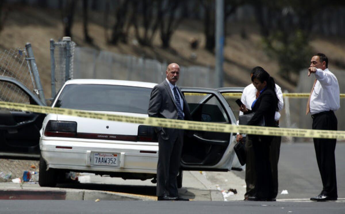 LAPD officials investigate a car-to-car shooting that occurred on the northbound 110 Freeway in South Los Angeles.