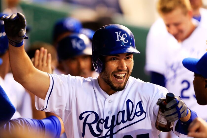 KANSAS CITY, MO - JUNE 25: Eric Hosmer #35 of the Kansas City Royals is congratulated in the dugout after hitting a home run during the 5th inning of the game against the Atlanta Braves at Kauffman Stadium on June 25, 2013 in Kansas City, Missouri. (Photo by Jamie Squire/Getty Images) ORG XMIT: 163494259