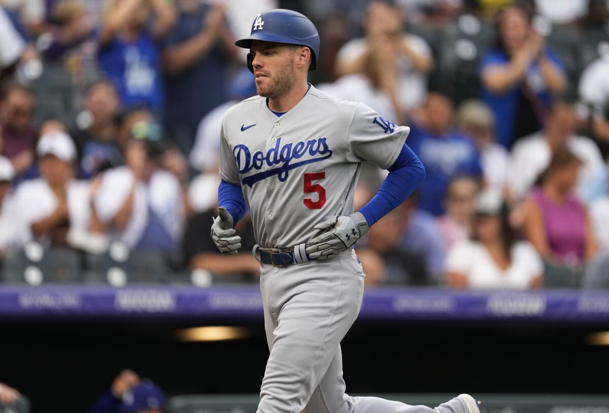 Dodgers' Freddie Freeman runs the bases after hitting a solo home run off Colorado Rockies pitcher German Marquez.