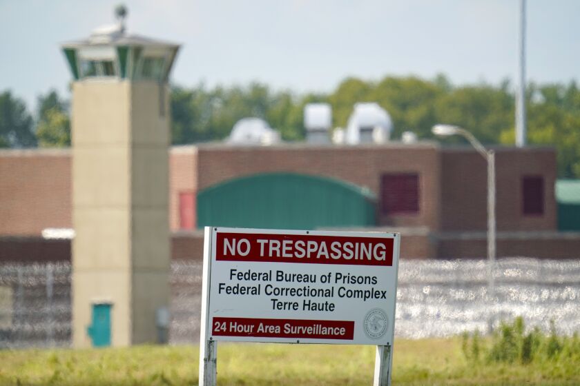 FILE - This Aug. 26, 2020 file photo shows the federal prison complex in Terre Haute, Ind. Rejon Taylor hoped the election of Joe Biden, the first U.S. president to campaign on a pledge to end the death penalty, would mean a more sympathetic look at his claims that racial bias and other trial errors landed him on federal death row in Terre Haute, Ind. An Associated Press review of dozens of legal filings shows that President Biden’s Justice Department is fighting just as vigorously as Donald Trump's did to uphold death row inmates' sentences, despite Biden's opposition to capital punishment. (AP Photo/Michael Conroy, file)