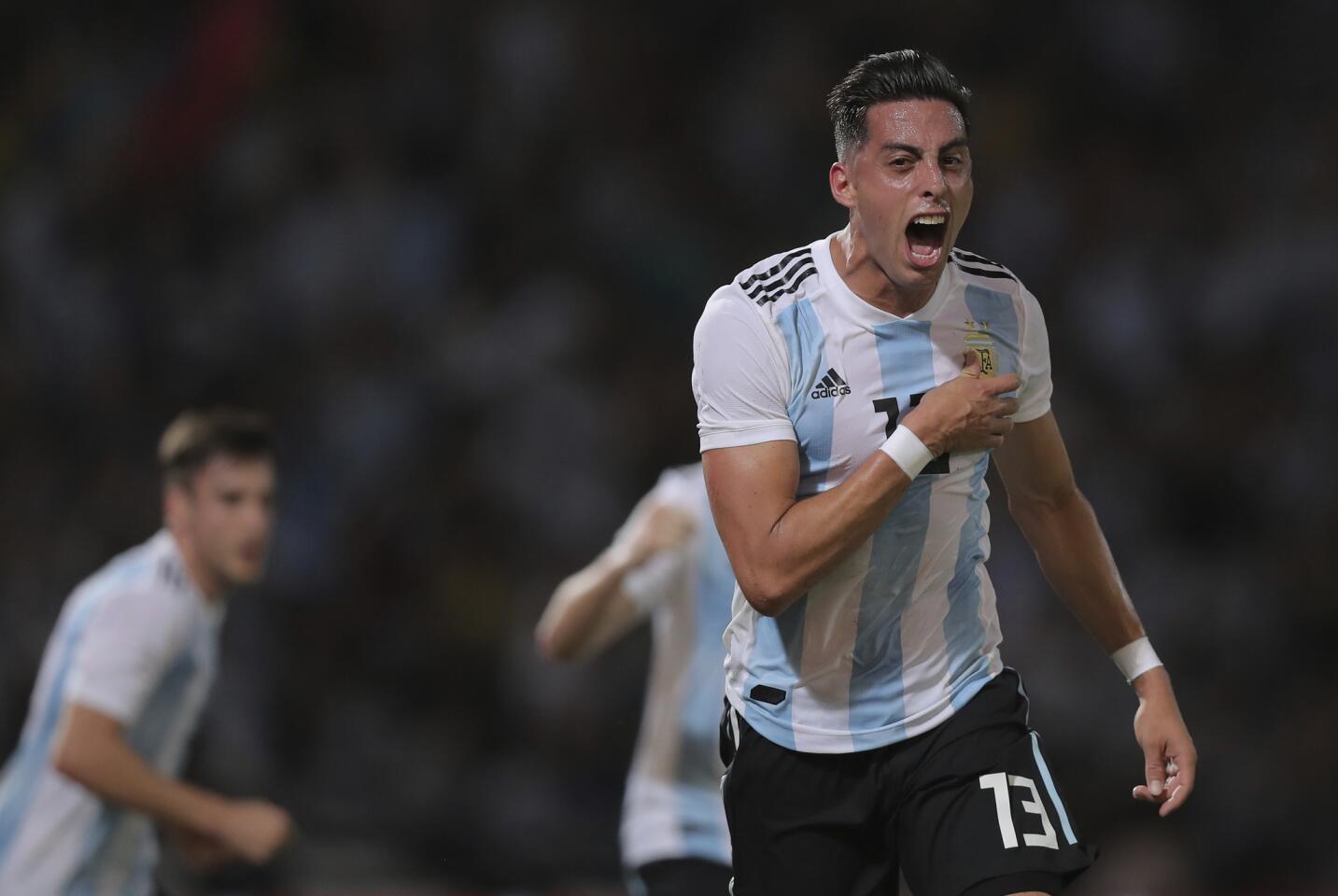 Argentina's Ramiro Funes Mori celebrates after scoring his team's first goal against Mexico during a friendly soccer match in Cordoba, Argentina, Friday, Nov. 16, 2018. (AP Photo/Nicolas Aguilera)