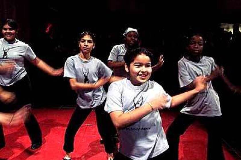 A group of girls performs at a party as part of Everybody Dance, a program created by Liza Bercovici in memory of her 13-year-old daughter, Gabriella.