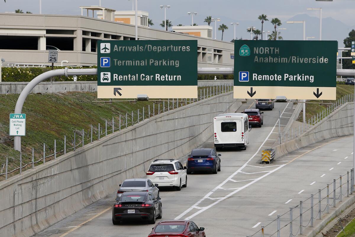 Motorists make their way into John Wayne Airport on Tuesday.