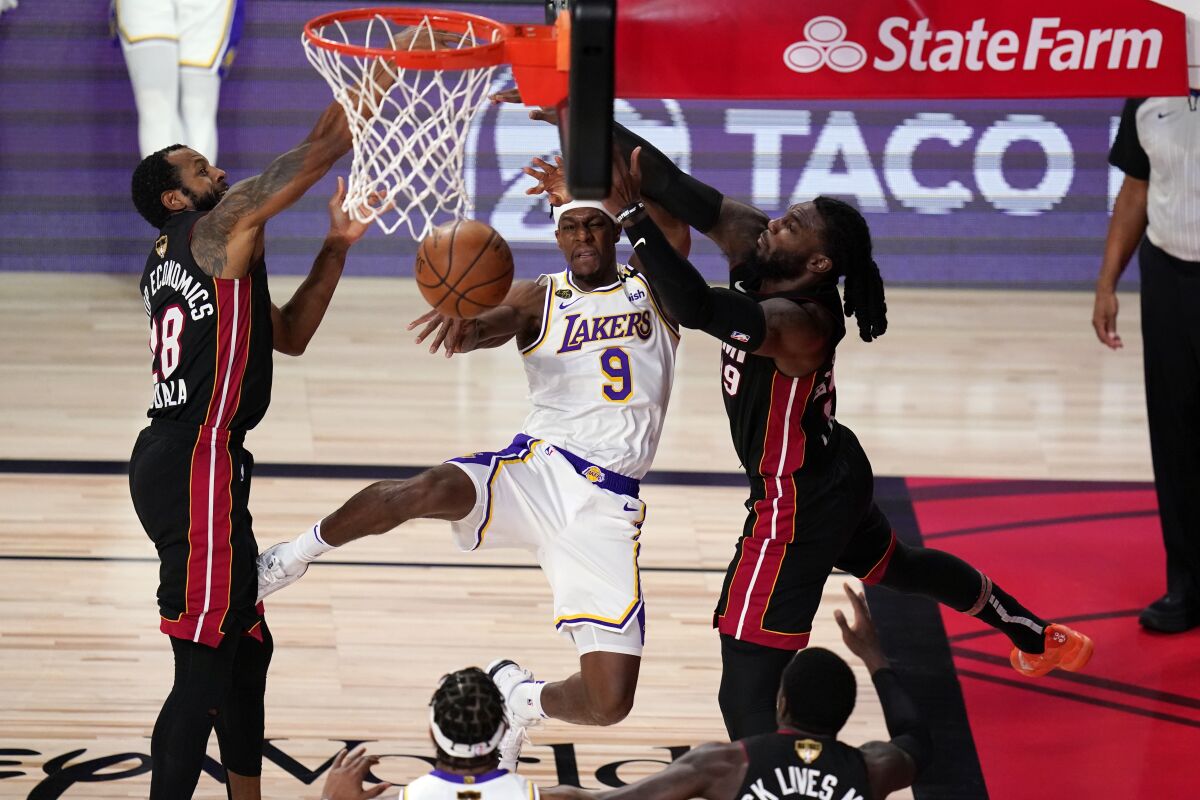 Lakers guard Rajon Rondo passes the ball after driving against the Heat during Game 6.