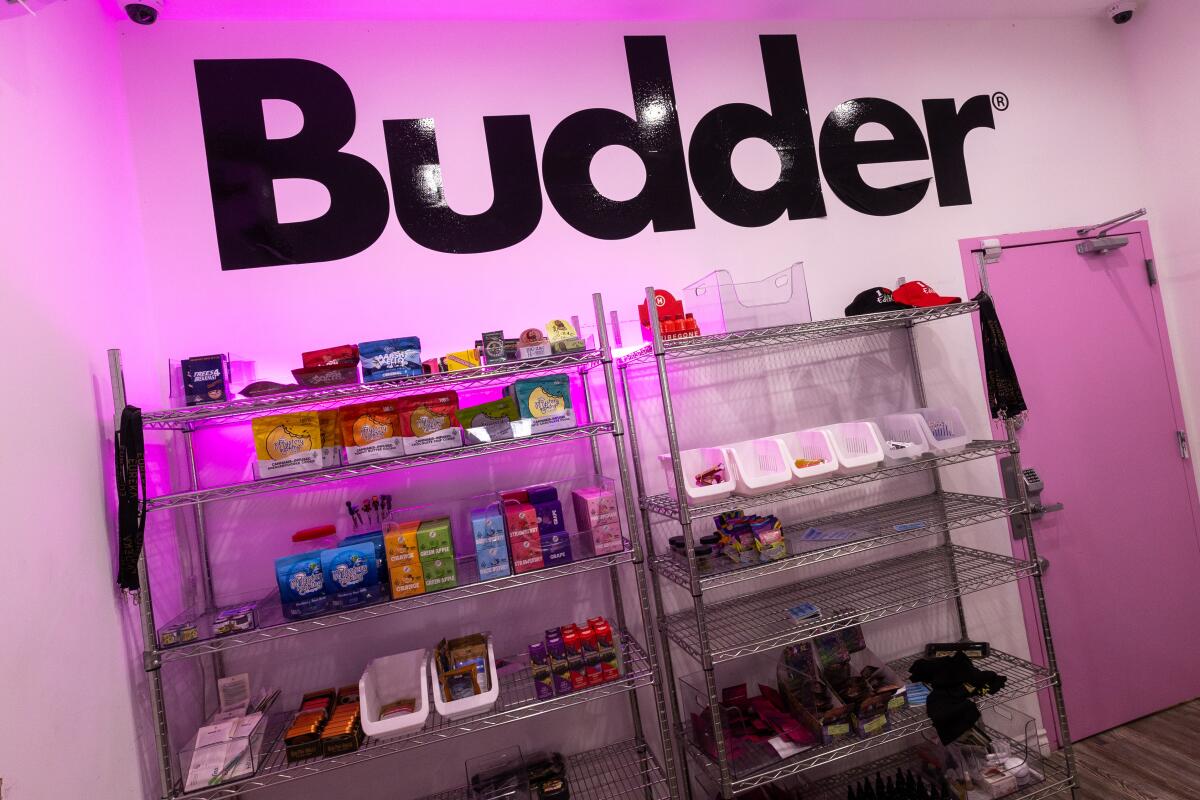 The word "Budder" is on a wall above some shelves.