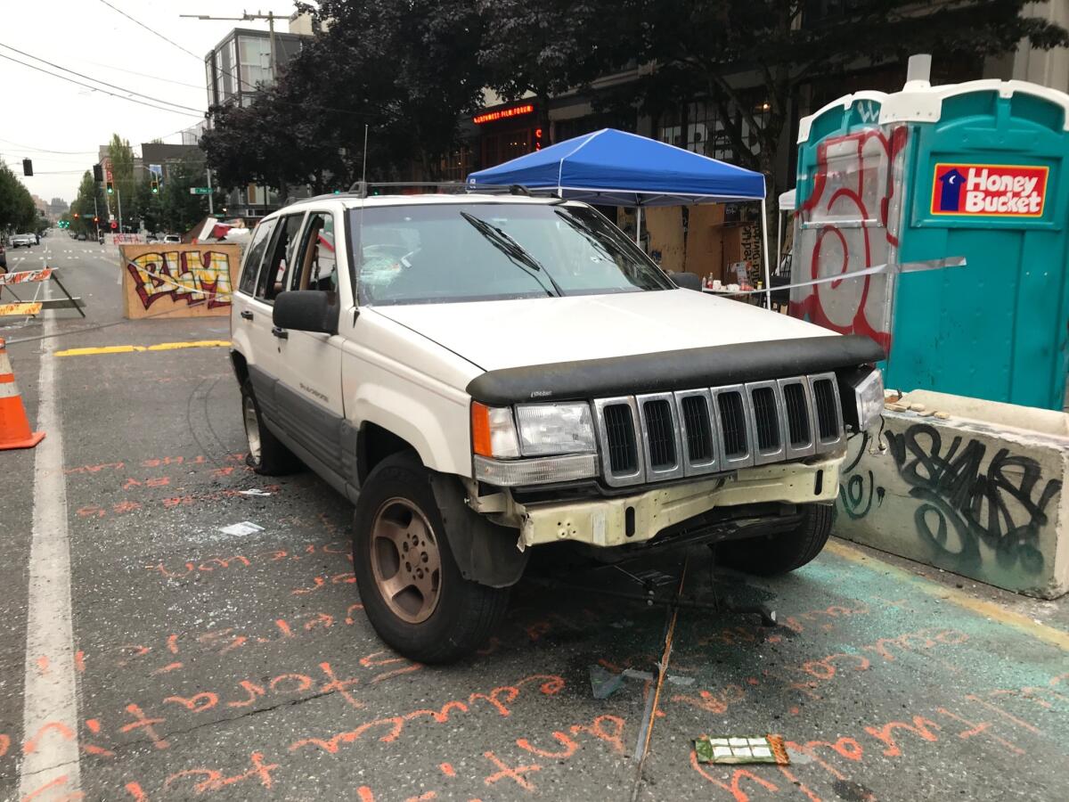 Shots were fired into a white SUV in Seattle's protest zone early Monday, according to 911 callers.