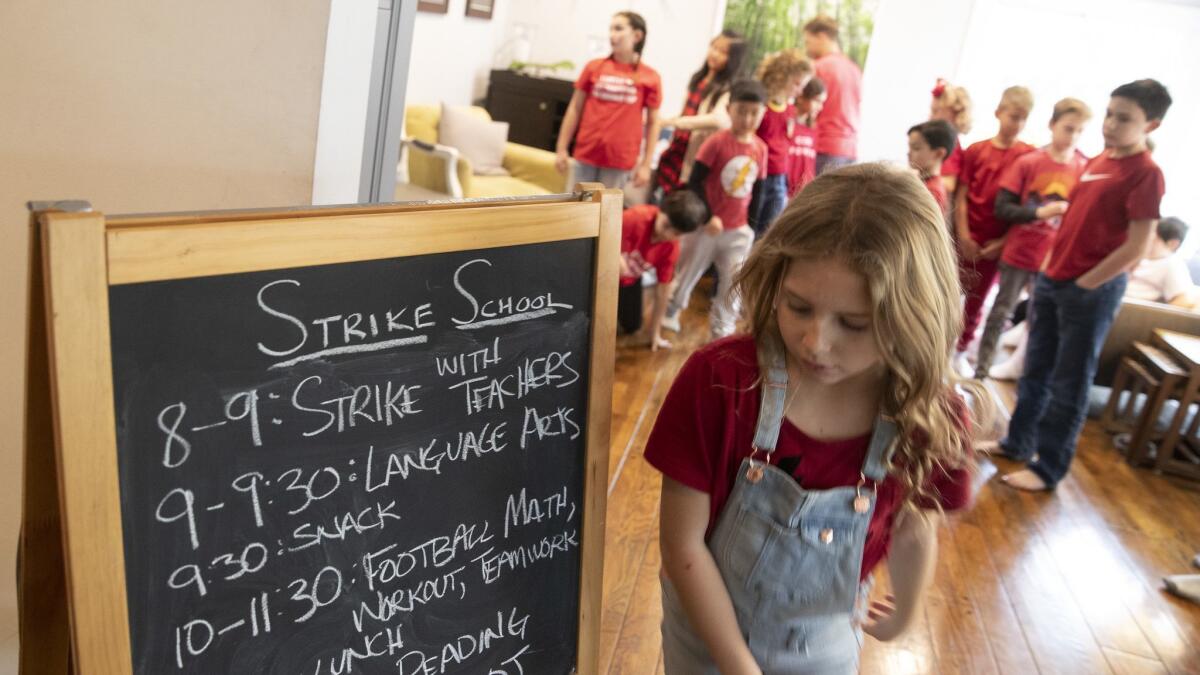 Kids from Encino Elementary School attend a community-organized "strike school" at the home of Corey and Kristin Moss in Encino. Parents are taking turns hosting kids in their homes and creating a curriculum for them.