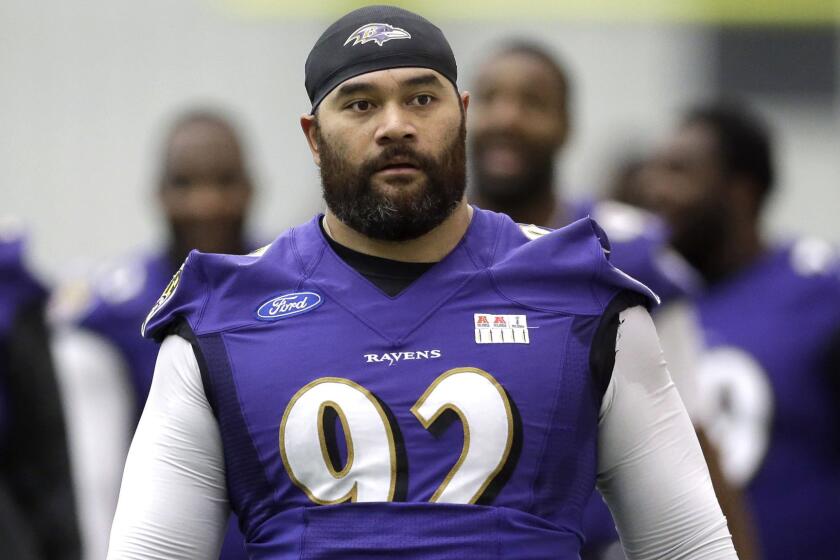 Baltimore Ravens defensive end Haloti Ngata walks off the field after a practice session in Owings Mills, Md., on Dec. 30, 2014. Ngata reportedly was traded to the Detroit Lions on Tuesday.