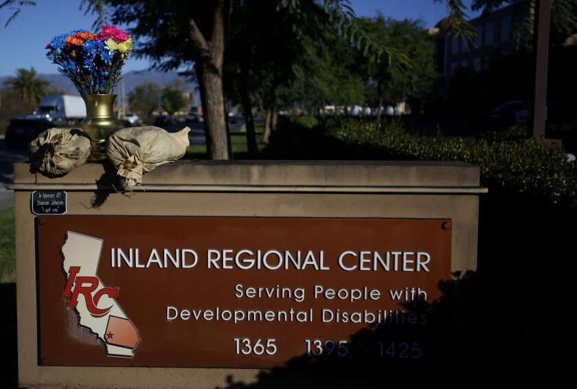 Flowers on the Inland Regional Center sign in memory of the victims of the Dec. 2, 2015, terrorist attack in San Bernardino.