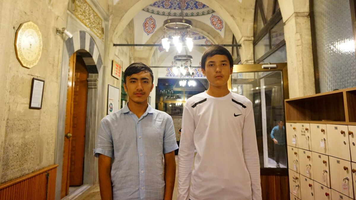 Adil Ahmad, right, 15, from Yarakan, says his parents are in a reeducation camp, and four of his siblings in China are missing, presumed in some kind of detention. Nuruddin, left, 16, says his parents are in a camp near their home in Urumchi.