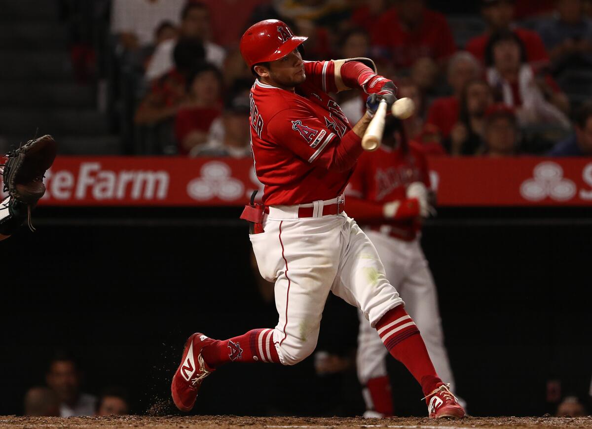 Angels shortstop David Fletcher hits a single.