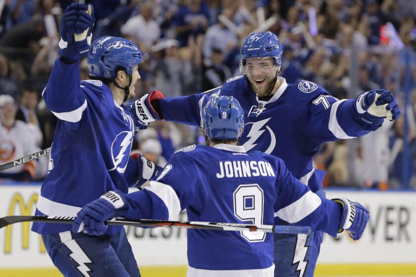 Lightning defenseman Victor Hedman (77) is congratulated by forwards Tyler Johnson (9) and Brian Boyle (11) after scoring a goal during the second period of a playoff game on April 30.