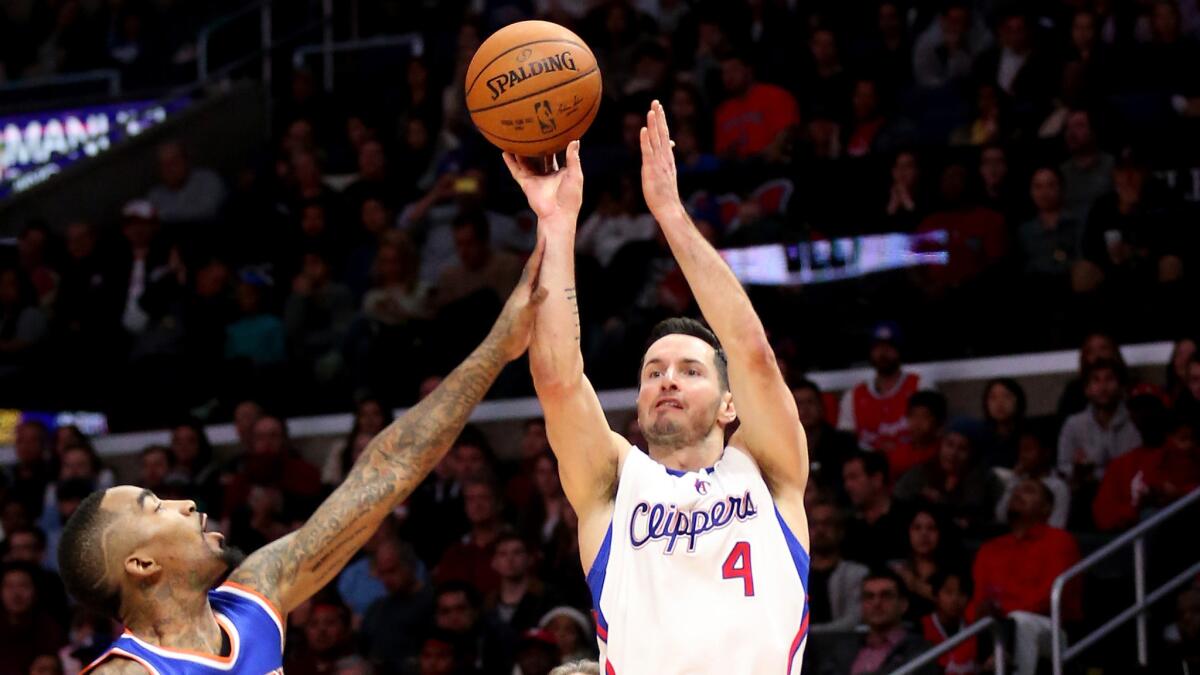 Clippers guard J.J. Redick, right, shoots a jumper over New York Knicks guard J.R. Smith during the Clippers' 99-78 win on Dec. 31. Redick is excited about getting the chance to compete in the NBA All-Star three-point contest.