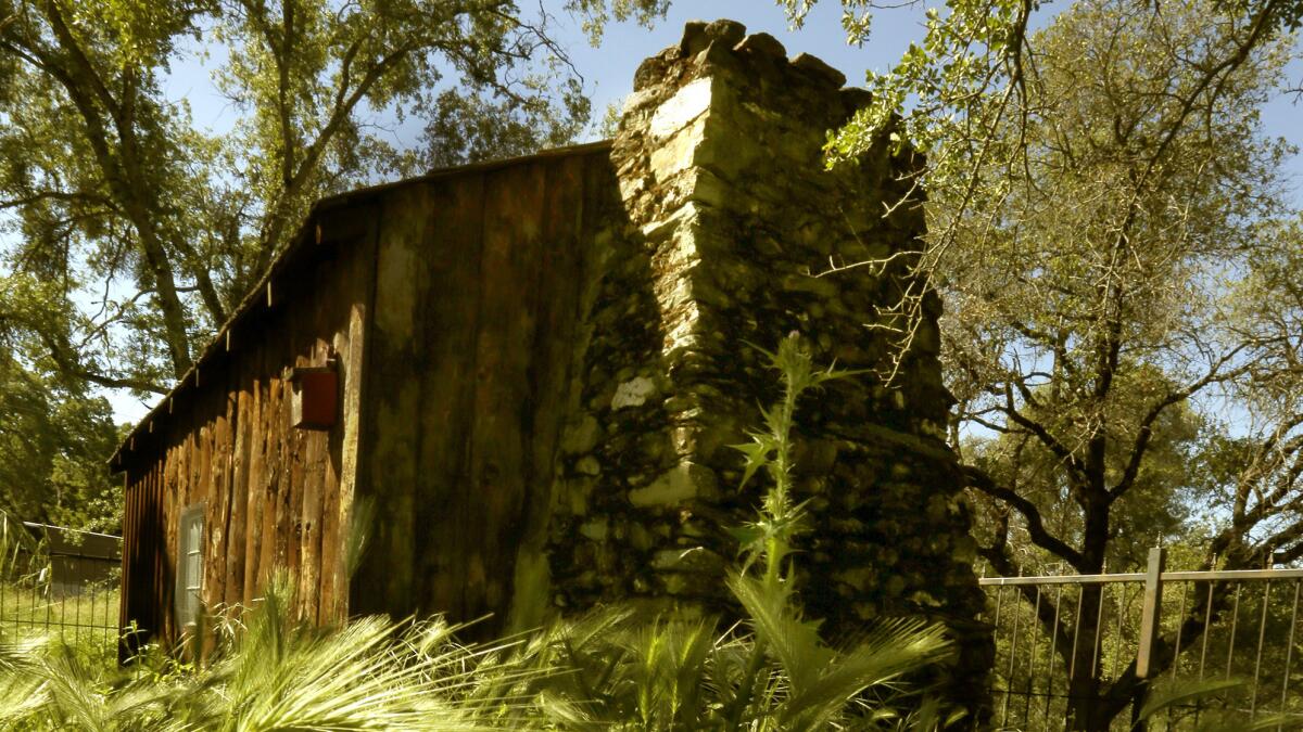 The cabin on Jackass Hill in Sonora, Calif., where Mark Twain stayed with other Gold Country characters has been rebuilt and reproduced several times in Tuolumne County but is still a big tourist draw. (Mark Boster / Los Angeles Times)