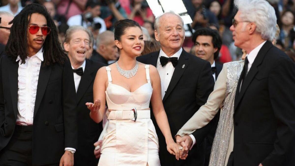 From left, actors Luka Sabbat, Selena Gomez and Bill Murray and director Jim Jarmusch arrive May 14 for the premiere of "The Dead Don't Die" at the Cannes Film Festival.