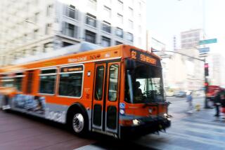 An L.A. Metro bus motors down Third Street in downtown Los Angeles on Aug. 7, 2015.