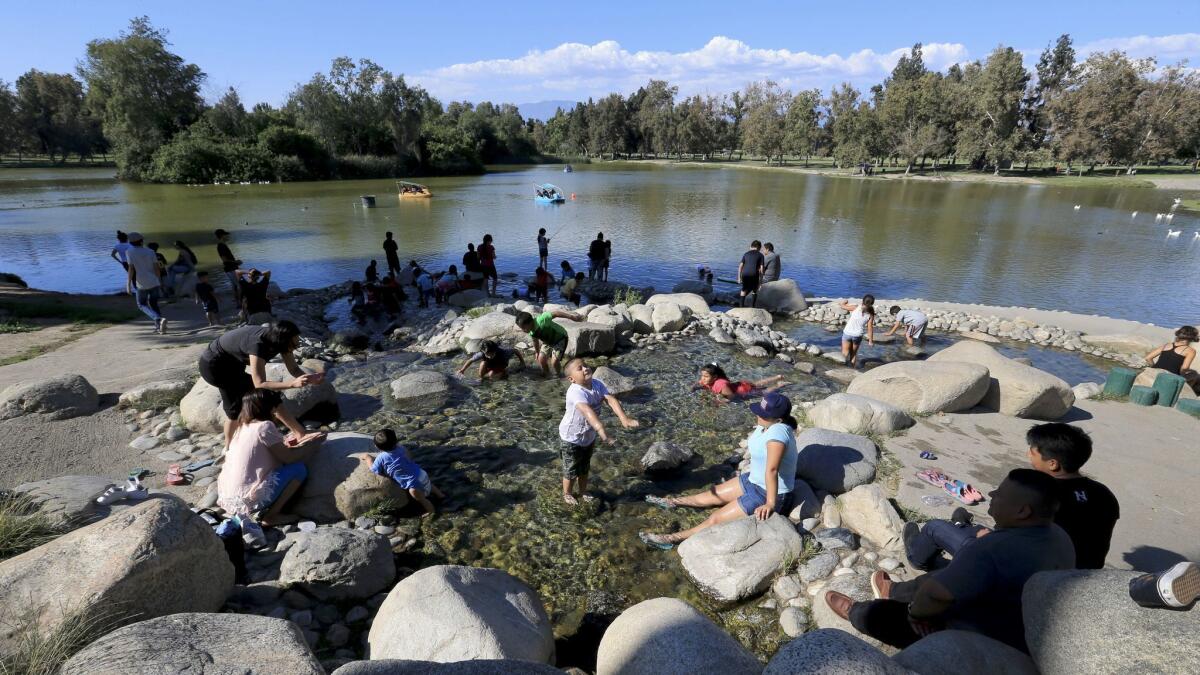 Kids play in the water at Whittier Narrows Recreation Area.