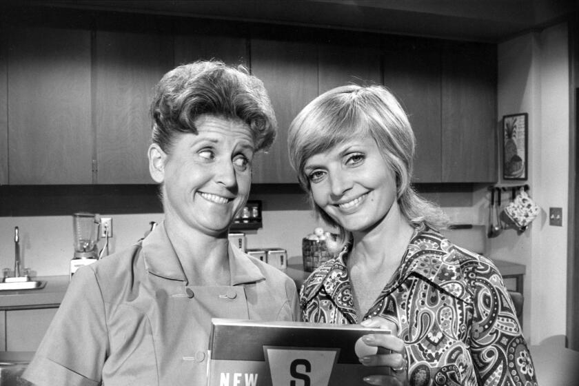 Ann B. Davis, left, and Florence Henderson starred in "The Brady Bunch."