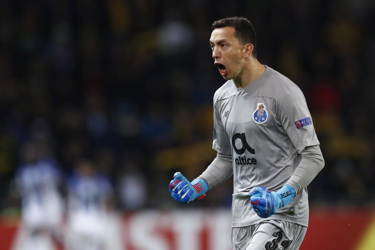 Porto's goalkeeper Agustin Marchesin celebrates as his team scores the 1-1 during the UEFA Europa League group stage match between Switzerland's BSC Young Boys Bern and Portugal's FC Porto, at the Stade de Suisse Stadium in Bern, Switzerland, Thursday, November 28, 2019.(Peter Klaunzer/Keystone via AP)