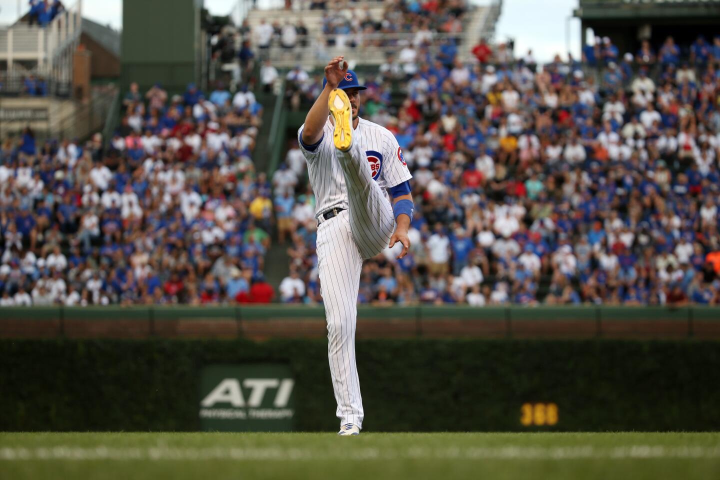 Cubs third baseman Kris Bryant stretches before the start of a game against the Diamondbacks at Wrigley Field on Monday, July 23, 2018.