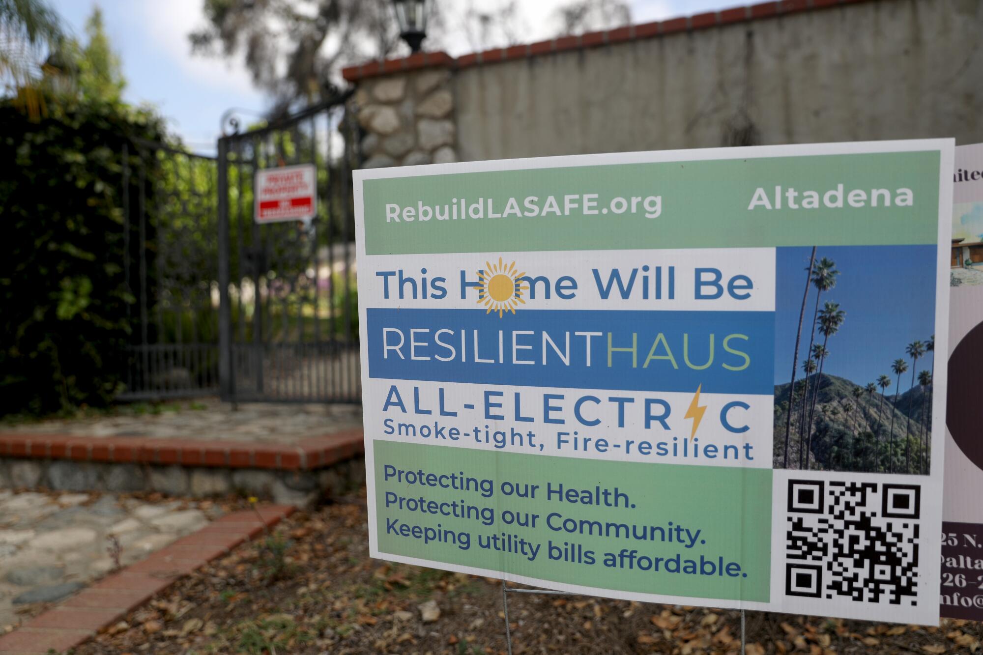 A sign announcing that an all-electric home will be built in Altadena.