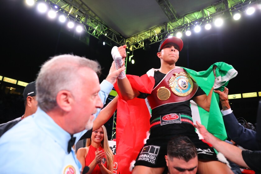 Jaime Munguia celebrates his super welterweight victory over Patrick Allotey.