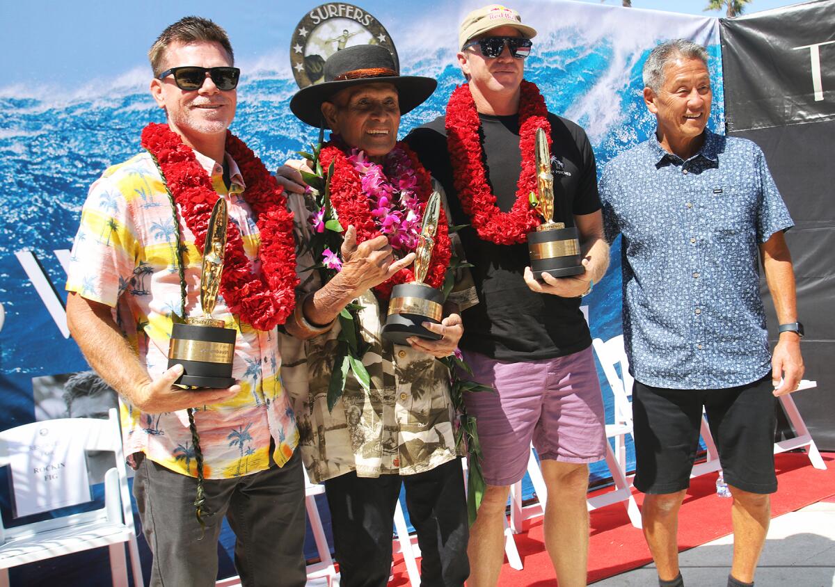 Surfers' Hall of Fame inductees, from left, Jeff Deffenbaugh, Ilima Kalama, Jamie O'Brien and founder Aaron Pai.