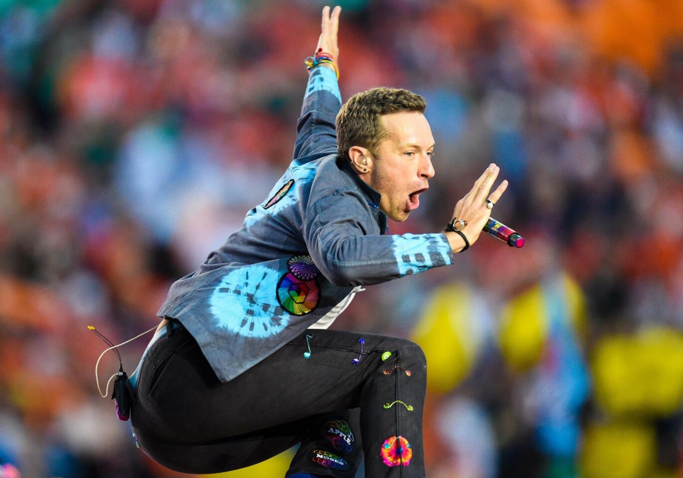 Recording artist Chris Martin of Coldplay performs during halftime between the Carolina Panthers and the Denver Broncos in Super Bowl 50 at Levi's Stadium. Mandatory Credit: Kyle Terada-USA TODAY Sports