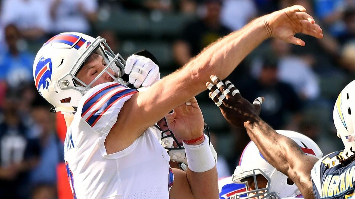 Bills quarterback Nathan Peterman gets hit while throwing an interception against the Chargers in 2017.