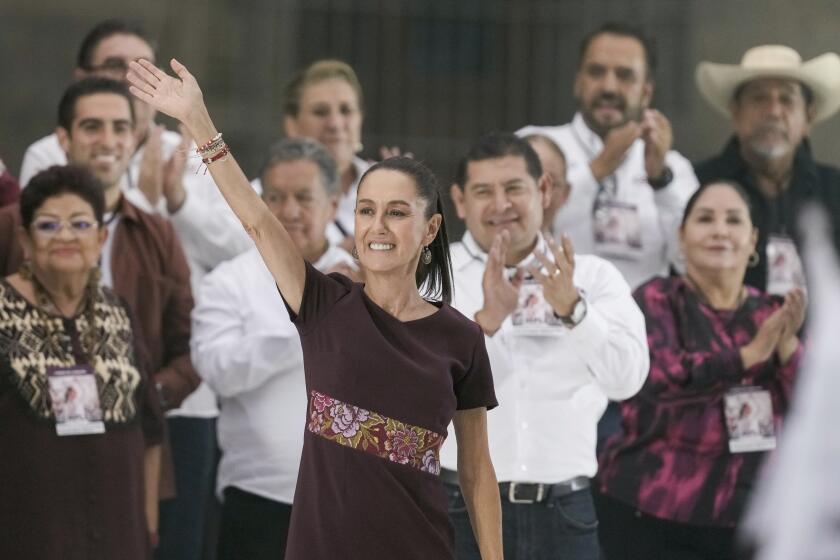 Presidential candidate Claudia Sheinbaum waves to the crowd at her closing campaign rally at the Zocalo in Mexico City, Wednesday, May 29, 2024. Mexico's general election is set for June 2. (AP Photo/Eduardo Verdugo)