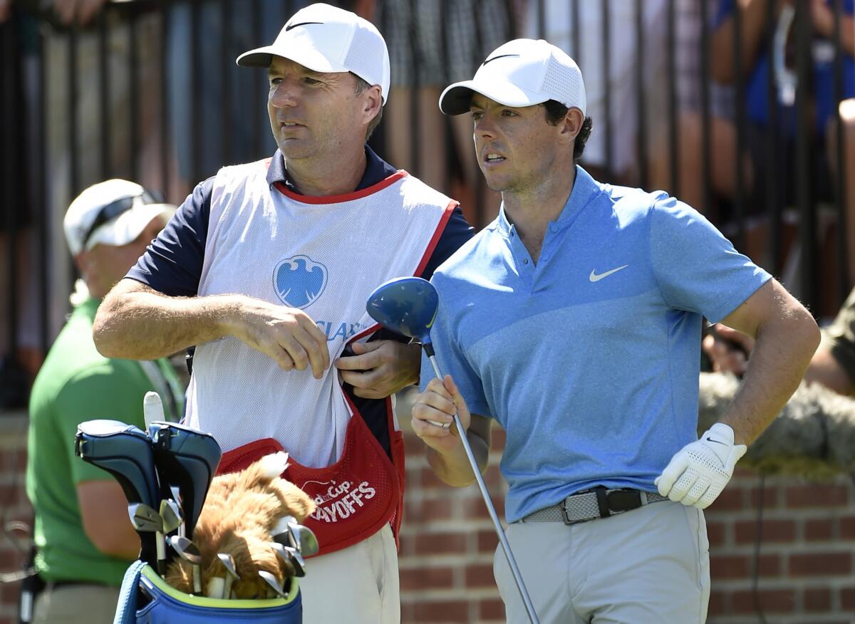 Rory McIlroy, right, stands with his caddy, J. P. Fitzgerald, during the Barclays tournament on Aug. 28.