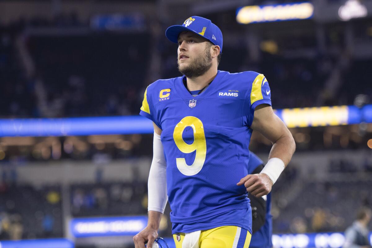 Rams quarterback Matthew Stafford jogs to the locker room after a playoff win over the Arizona Cardinals.