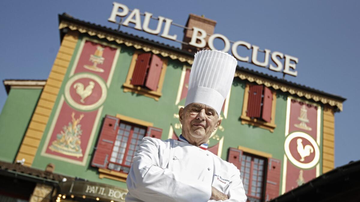 Chef Paul Bocuse stands outside his famed Michelin three-star restaurant, L'Auberge du Pont de Collonges, in Collonges-au-Mont-d'or in central France in March 2011.