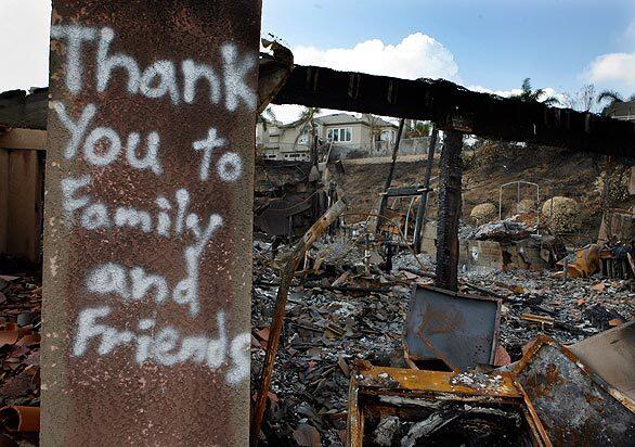 A sign shows appreciation on the wall of a Aviemore Drive home destroyed during the Freeway Complex Fire in Yorba Linda.