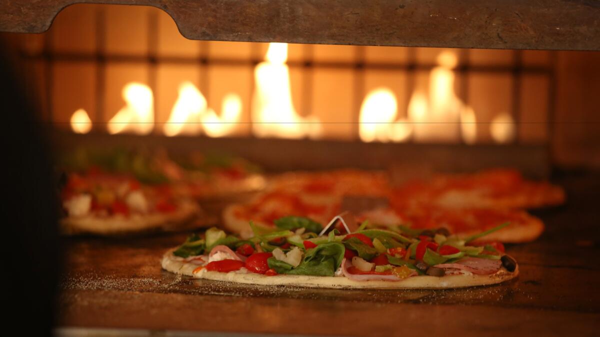 Blaze Pizza differentiates itself from traditional pizza chains with its ovens, promising custom pies with short waits.
