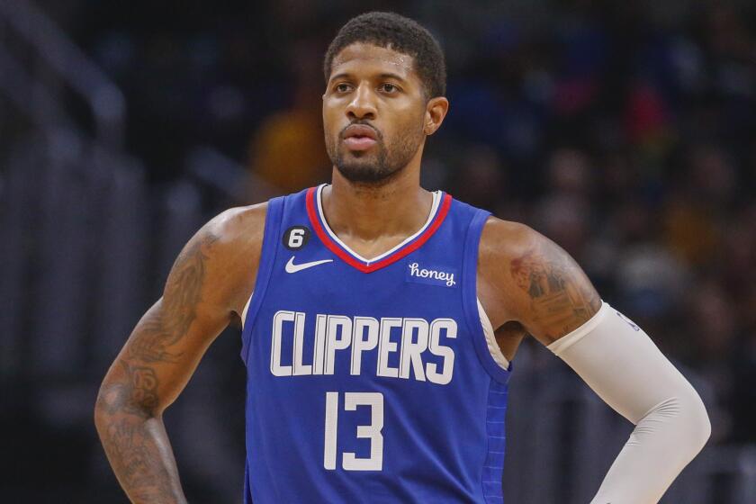 Los Angeles Clippers forward Paul George (13) looks on during the second half of an NBA basketball game.